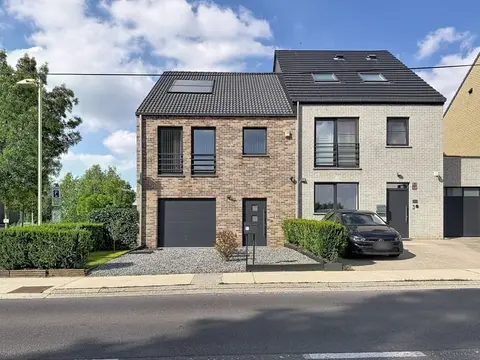 Three-bedroom home with a garden and garage